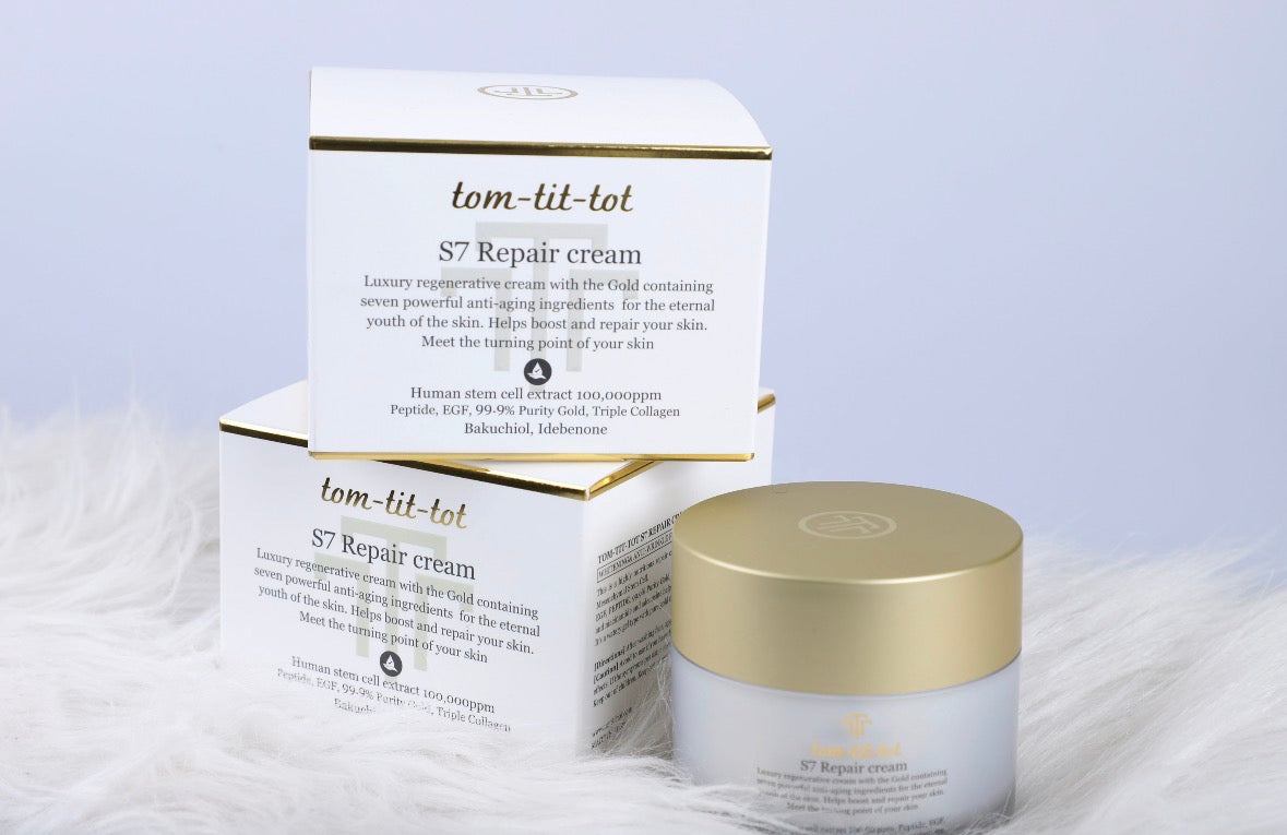tom-tit-tot s7 repair cream in a grey tub with a gold lid. White box reads "luxury regenerative cream with the gold containing anti-aging ingredients."