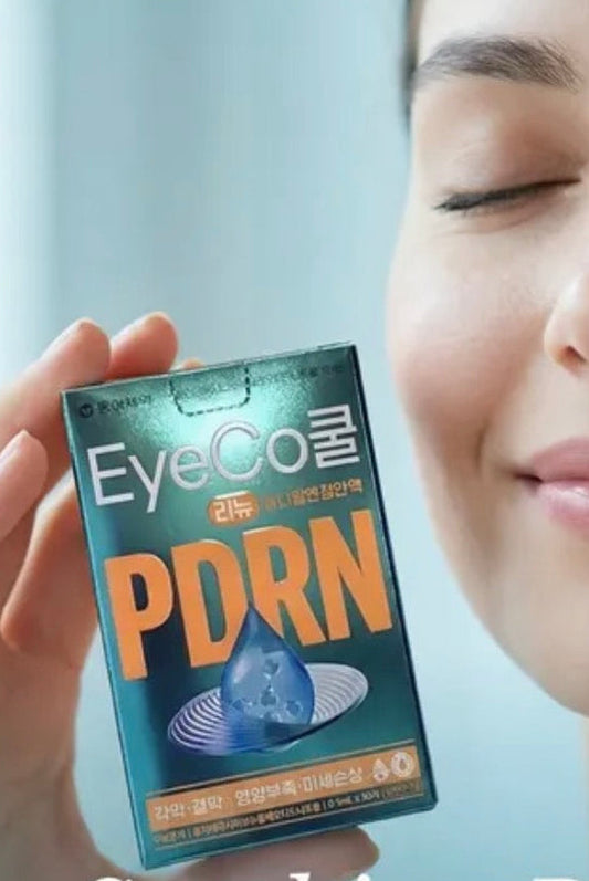 Person holding a box of EyeCo PDRN eye drops. Blue box contains 30 .5ml lubricating eye drops packed in convenient single use vials for portability and sterilization. Reduce irritation from dry eyes. 