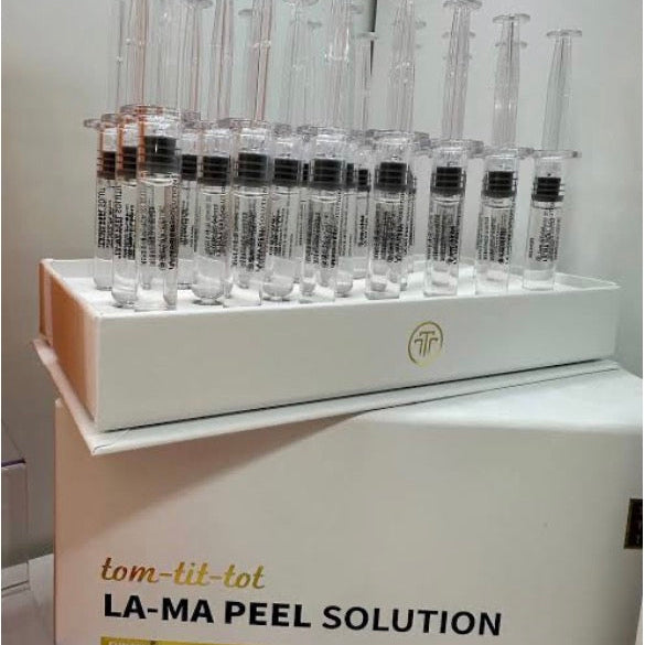 Display of syringes with a box labeled 'LA-MA Peel Solution' on a white background