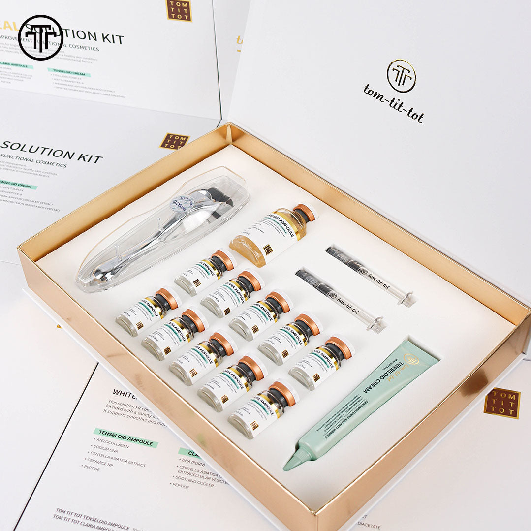 Cosmetic solution kit with various vials and tools in an open box, featuring the Tom Tit Tot logo.