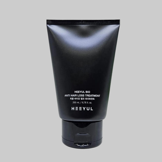 Black tube of HEEYUL BIO anti hair loss treatment on a white background